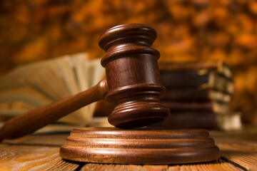 Law and justice concept. Mallet gavel of the judge, scales of justice, books. Copy space for text