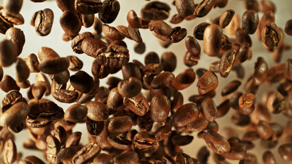 Coffee beans flying in the air in freeze motion.