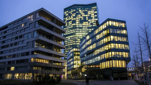 Office building exterior time lapse at night. Business city office concept. Prime tower Zurich Time lapse video at night