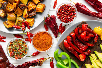 Tasty mexican snacks, sandwiches with avocado and another vegetables. Baked sweet potatoes and...