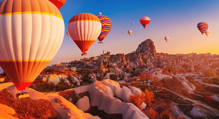 Hot air balloons fly over deep canyons, valleys Cappadocia, Goreme National Park Turkey, aerial drone view