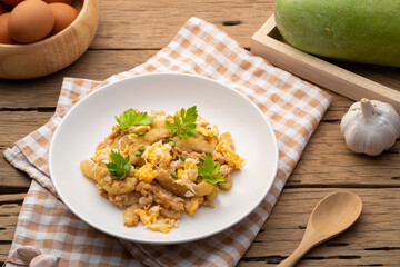 stir fried winter melon(Wax Gourd) and Egg with Oyster sauce in white plate
