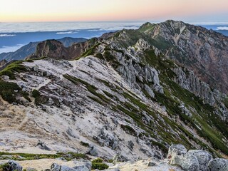 The traverse to Mt. Minami-Komagatake seen from Mt. Utsugi on an October morning. Okuwa Village, Nagano Prefecture, Japan