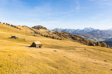 Remote mountain cabin at a mountain pasture in South Tyrol in Italy during autumn