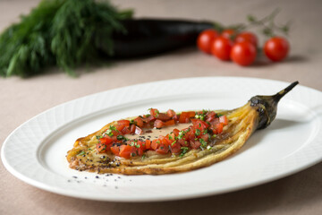 baked eggplant with vegetables and herbs