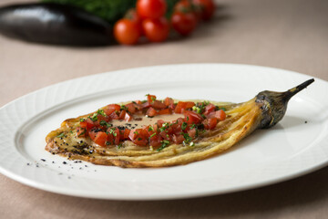 baked eggplant with vegetables and herbs