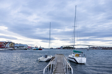 Fototapeta premium Fishing boatsand sailboats at the quay in Brønnøysund, Helgeland, Norway, Europe