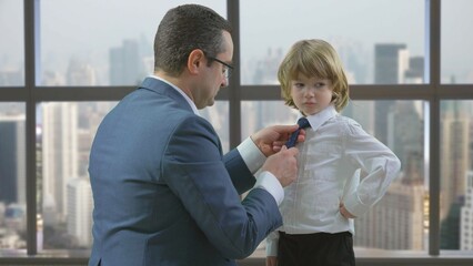 Father arrange child tie, innocent blonde hair child, window office panorama