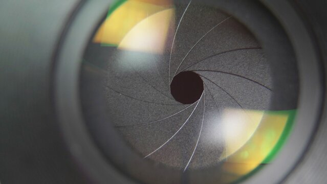 Front view close detail of photo lens aperture blades opening