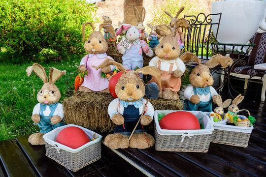 Colourful Easter decorations and bunnies displayed near an outdoor terace