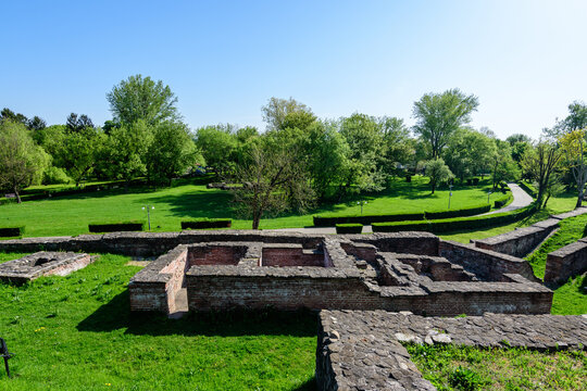 Old buildings and ruins at Targoviste Royal Court (Curtea Domneasca) in Chindia Park (Parcul Chindia) in the historical part of the city  in a sunny spring  day, in Romania