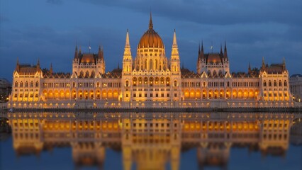 Fototapeta na wymiar Budapest Parliament mirrored in Danube River at dusk