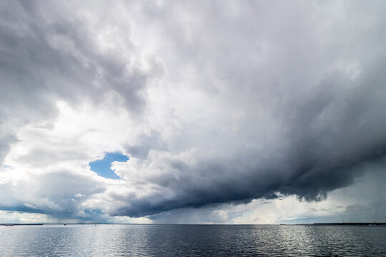 The sky before the rain. Storm clouds over the water. © Rudi