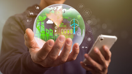 The concept of a circular economy. A globe in one hand, surrounded by a circular economy emblem. Circular economy and design for reuse and renewable material resources for corporate growth