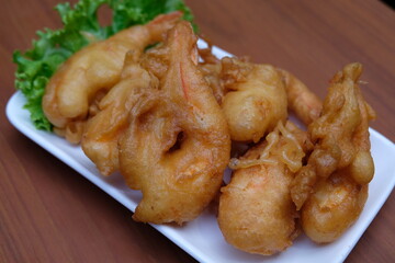 batter-fried prawns on white plate