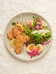Crispy fried chicken with fresh salad