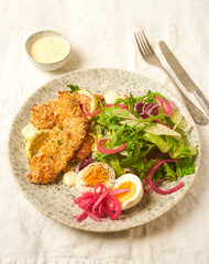 Crispy fried chicken with fresh salad
