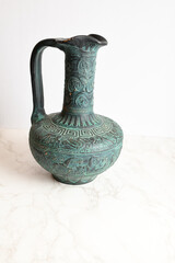 Green Greek Vase on White Marble Background