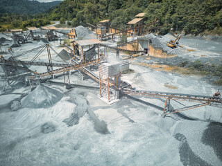 Stone crushing system at open pit mining quarry.
