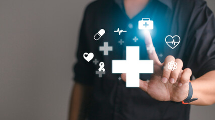 Businessman hold virtual plus medical network connection icons. Covid-19 pandemic develop people awareness and spread attention on their healthcare.Doctor,document,medicine,ambulance,patient - obrazy, fototapety, plakaty