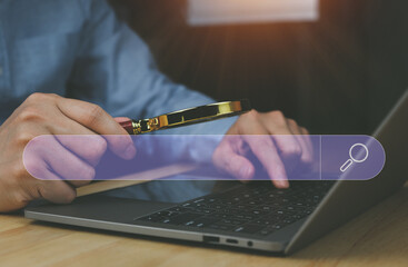 businessman using magnifying glass business idea on the virtual screen search technology Marketing to Increase Data Search Using Search for Data