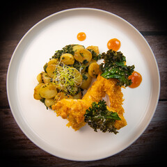 Recipe for Breaded Chicken Tenders and Potatoes with Sesame Kale Chips and Sweet and Sour Sauce. High quality photo