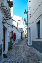 Obraz premium A narrow street among the old houses of Melfi, a village in the province of Potenza in Italy.