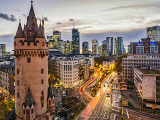 Eschenheim Tower, old and new Frankfurt city buildings with light rail after sunset, Germany - obrazy, fototapety, plakaty