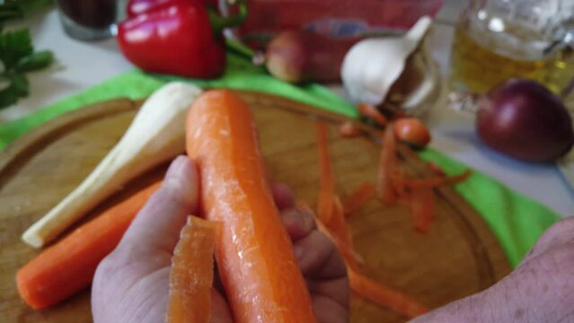 Piling carrot pov close up follow shot. Healthy food preparation. Raw vegetables. High quality 4k footage