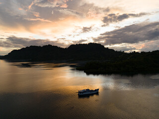 The last light of day illuminates clouds drifting above remote islands in the Solomon Islands. This beautiful country is home to spectacular marine biodiversity and many historic WWII sites.