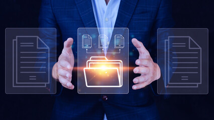 Document Management System (DMS) being setup IT consultant working on laptop computer in office. Software for archiving, searching and managing corporate files information