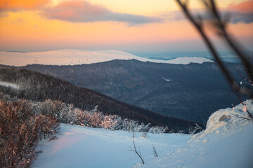panorama of snow-capped mountains bieszczady at sunset, winter sunset seen from the top of the mountain wielka rawka © Lens Down Under