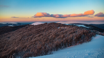 panorama of snow-capped mountains bieszczady at sunset, winter sunset seen from the top of the mountain wielka rawka © Lens Down Under