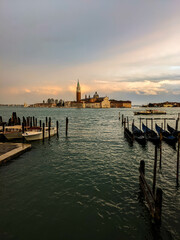 View of San Giorgio Maggiore island in Venetian Lagoon, sailing boats in Giudecca Canal. Venezia, Veneto