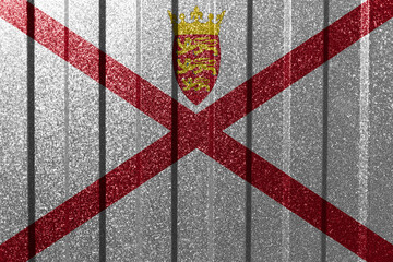 Fototapeta na wymiar Textured flag of Jersey on metal wall. Colorful natural abstract geometric background with lines.