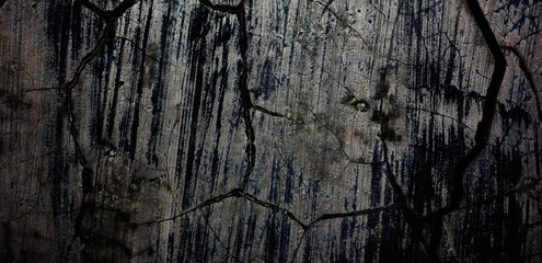 Energetic background image of cracked and eroded old cement wall.