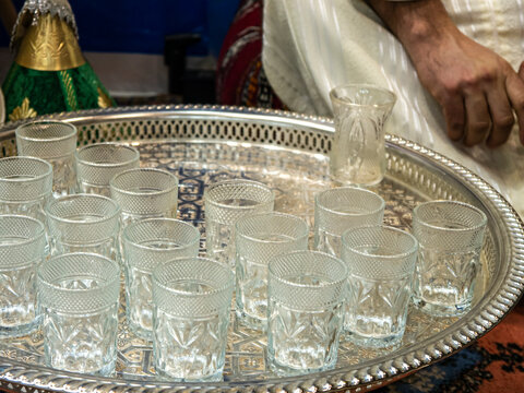 Set of glasses for the traditional Moroccan tea ceremony at the Morocco stand in FITUR 2022