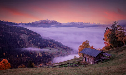 Misty, foggy morning sunrise on the Alpine lake in autumn. Pink Dramatik Sky over the Zeller Lake...