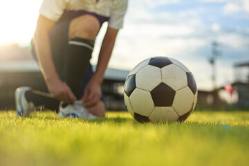 sport outdoors of athlete playing soccer football for exercise and recreation at the green grass field