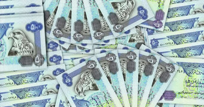 Arab Emirates Dirhams banknotes in a cash fan mosaic pattern loop. Dubai 500 AED notes. Abstract concept of bank, finance, economy seamless and looped decorative design background.