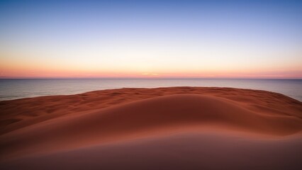 Obraz na płótnie Canvas Seaside with dunes at sunset.