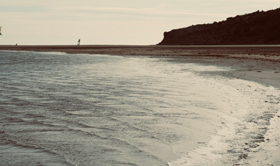 Leucate beach in the south of France in Languedoc Roussillon in France. Windsurfing in the mediterranean sea with space for text. Landscape in Luecate, Aude.