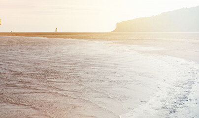 Obraz premium Leucate beach in the south of France in Languedoc Roussillon in France. Windsurfing in the mediterranean sea with space for text. Landscape in Luecate, Aude.