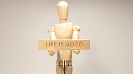 Life is good written on the wooden surface. Wooden Concept