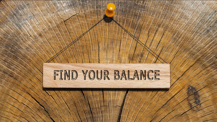FIND YOUR BALANCE is written on the wooden surface. Wooden Concept