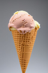 Variety of ice cream scoops in cones with chocolate and vanilla. IA Tehnology
