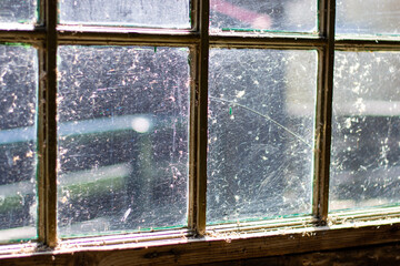 Old damaged shabby window in poor condition