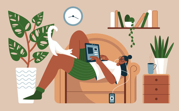 Girl lying in home armchair with laptop vector illustration. Cartoon happy young woman listening to music with headphones, working or studying online on couch with cat in living room interior