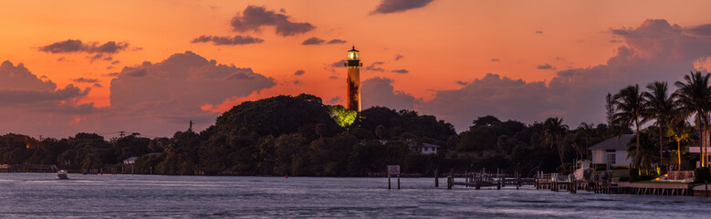 View to the Jupiter lighthouse on the north side of the Jupiter Inlet at sunset.