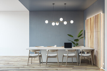Front view on light conference table with laptop and chairs around on parquet floor in spacious meeting office room with backlit wooden and grey wall background. 3D rendering